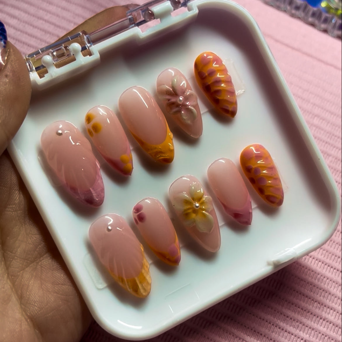 Set of coral/pink vibes press-on nails with orange and pink custom french tip. 3D Flowers, lines with pearls custom nails.