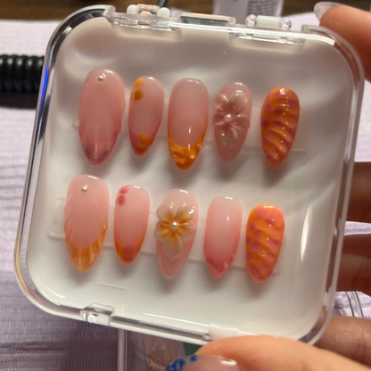 Set of coral/pink vibes press-on nails with orange and pink custom french tip. 3D Flowers, lines with pearls custom nails.